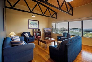 The main lounge features soaring ceilings and plenty of seating for movie nights or rainy days in.