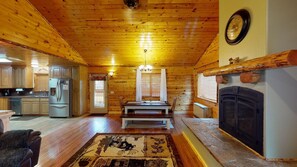Dining room area is equipped with a table perfect for everyone to sit at.