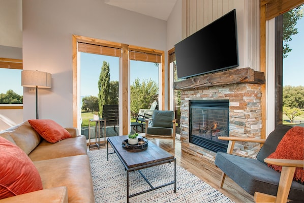 Living Room with Contemporary Furnishings, 55" Smart TV, and Gas Fireplace Overlooking the Golf Course