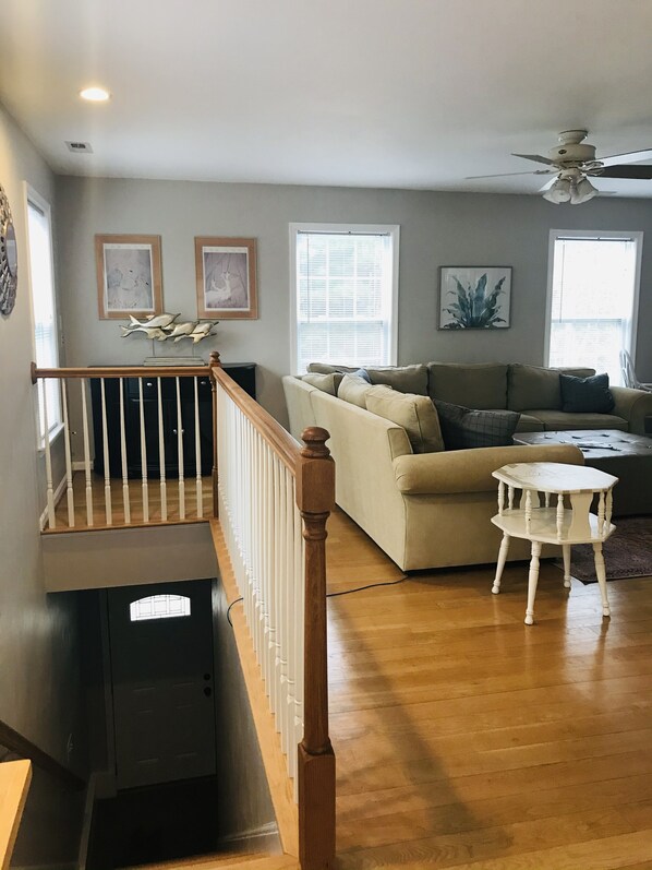 Entrance stairs and den view.  The many large windows create a treehouse affect.