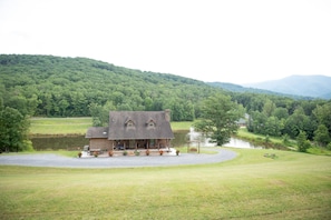 Cabin and parking area with lake view