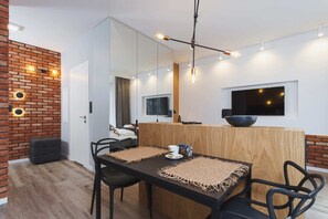 Large table with chairs for eating communal meals. 