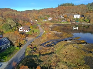 Aerial view showing proximity of the bay and the Salen Hotel stone building 300m