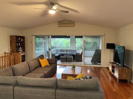 Relax in the comfort of upstairs living room or step outside to undercover area