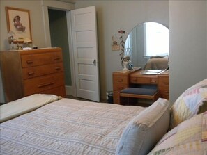 First floor bedroom with queen size bed. Attached bath with walk-in shower.