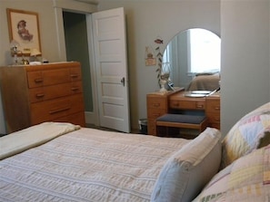 First floor bedroom with queen size bed. Attached bath with walk-in shower.