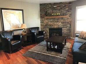 Living room with fireplace overlooking Georgian Bay