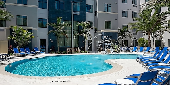 Large heated swimming pool, hot tub, poolside loungers and BBQ grills