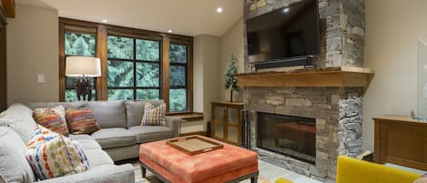 Living area with fireplace and wall-mounted TV