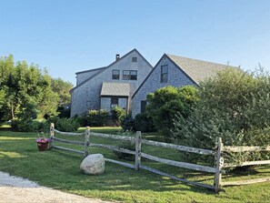 View from street of barn and home