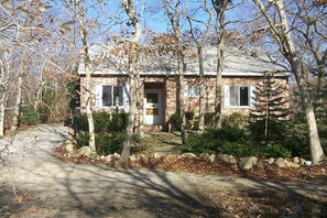 Front of house with Yard and Driveway.