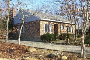 Side view of front of house and driveway.