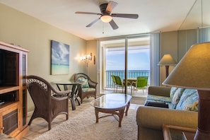 Oceanfront living room offering indoor and outdoor dining.