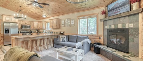 Open concept living room, kitchen, and dining. 