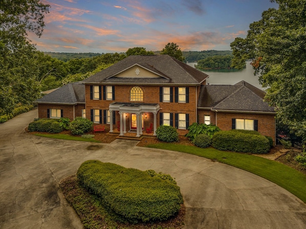 Nestled on 3.5 acres atop a hill.  Panoramic views of Lake Lanier & NG Mnts