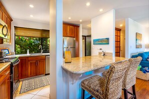 Functional kitchen with loads of counter space for prepping, visiting and eating