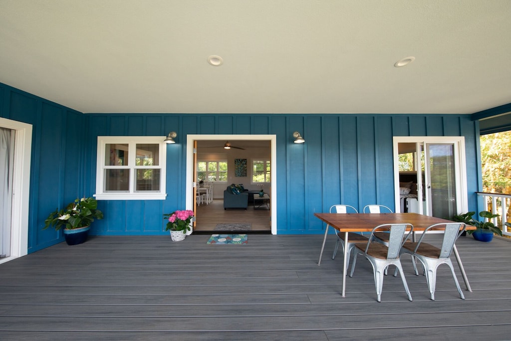 Wooden deck of a petrol-colored house on the North Shore