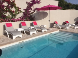 Plenty of quality sunbeds which will lie flat. Steps into the pool