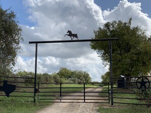 Entry gate for 1.3 mi peaceful ride to home east of Hwy 46 & 123 & 123 Business.