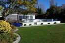 Main house from Lake and pool area on deck