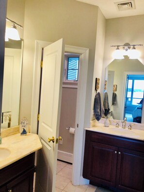 Master bathroom with private toilet room and double vanities.