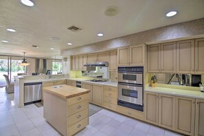 The kitchen has stainless steel appliances.