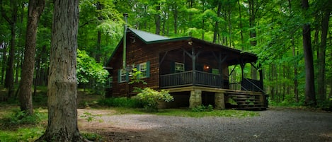 Front of cabin with enough parking for two vehicles 