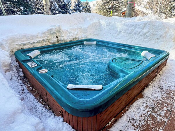 Soothe your muscles after a long day in the mountains in this private hot tub!
