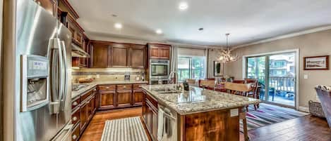 You'll absolutely love cooking in this modern kitchen with stainless steel appliances and granite countertops