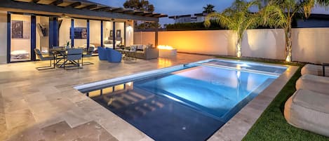Relax and revive in an entertainers dream backyard. Heated pool and huge hot tub