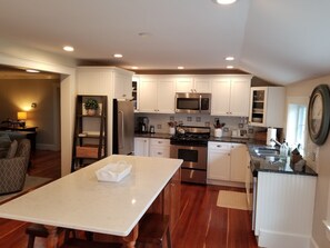 Open Concept Kitchen into Living RmCustom Center Island Kitchen w seating for 6 