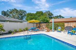 The large heated swimming pool is professionally serviced twice per week and has night lighting inside and around the pool area. Sun lounge area.  Outdoor shower.  Propane grill. Outdoor dining space for 8 guests.