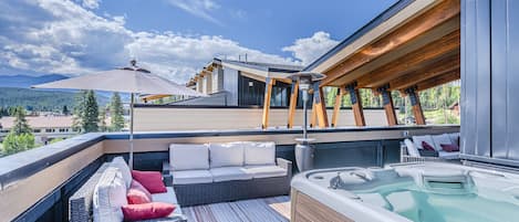 Rooftop Deck - An amazing amenity which includes lounge style seating, patio dining set, private hot tub, and beautiful views.