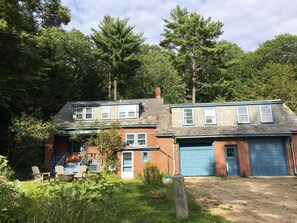 Main unit to left with apartment unit over garage.