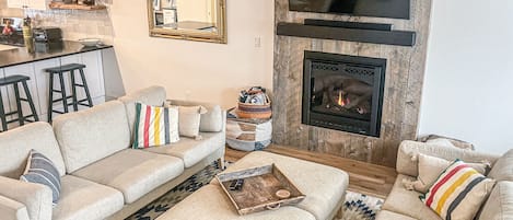 Family room with gas fireplace and soundbar