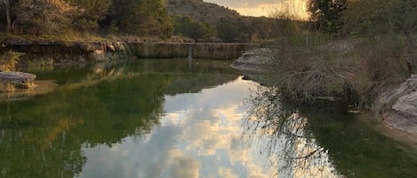 Hill country skies reflected on Lone Man Creek