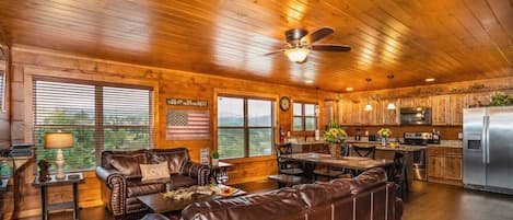 Spacious living room is perfect for bringing everyone together! (Couch also turns into Queen sofa sleeper)