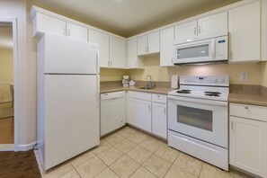 Prepare a meal in the equipped kitchen.