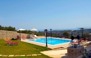 Pool with sun loungers