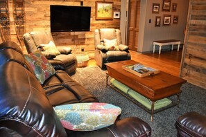 Cozy space with pallet wall and flat screen TV. Relax after a day of exploring!