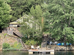 View of cottage and dock area from lake