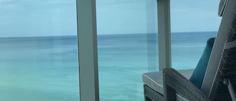Relax on your chaise and enjoy the view of the ocean from your private balcony