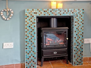 Charming fireplace with electric woodburner | Sea Glass Cottage, Holcombe, Teignmouth