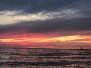 Lake Michigan sunset with the Holland Harbor pier in the background