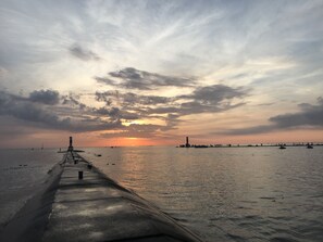 South side pier @ the Holland Harbor channel. Just 10 minutes walk up the beach.