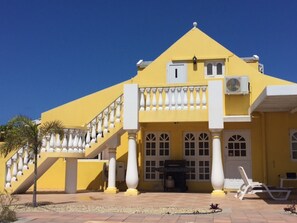 Back of Property showing stairs and door leading to private studio apartment