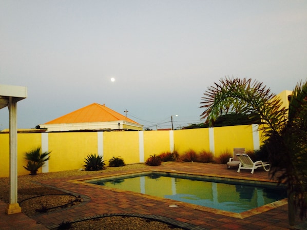Private pool at dusk in the moonlight