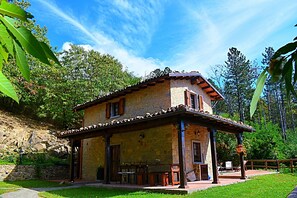 There are 2 covered dining areas as well as an outdoor oven