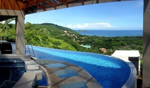 Pool, jacuzzi and walkway from car park to front patio