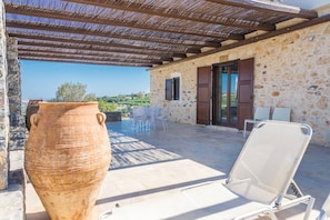 The large pergola offers both shaded and sunny spots